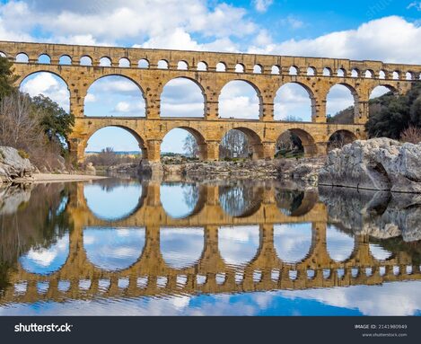 stock-photo-the-magnificent-pont-du-gard-an-ancient-roman-aqueduct-bridge-vers-pont-du-gard-in-southern-2141980949.jpg